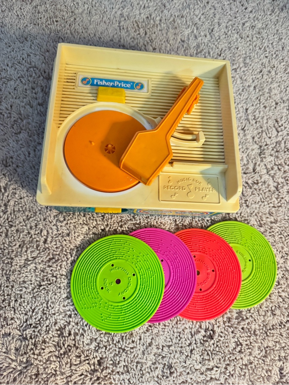 Fisher-Price Cream and Orange Toy Record Player with Pink Green Red Discs